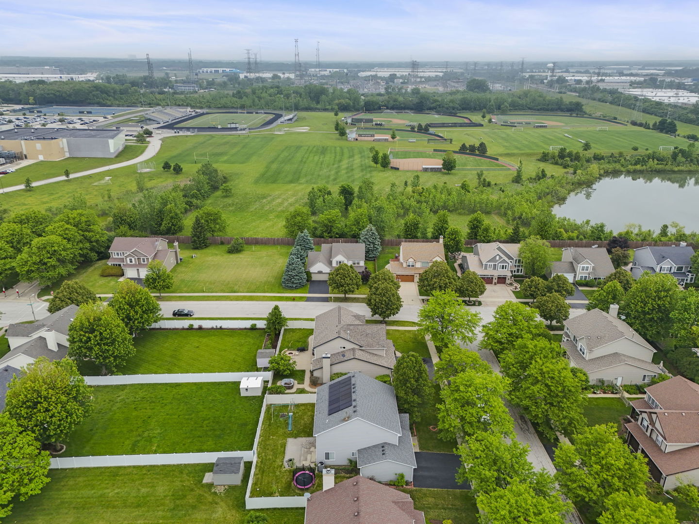 1462 Haversham Drive Aurora, IL 60502 - Photo 43 of 44 an aerial view of green landscape with trees houses and back yard