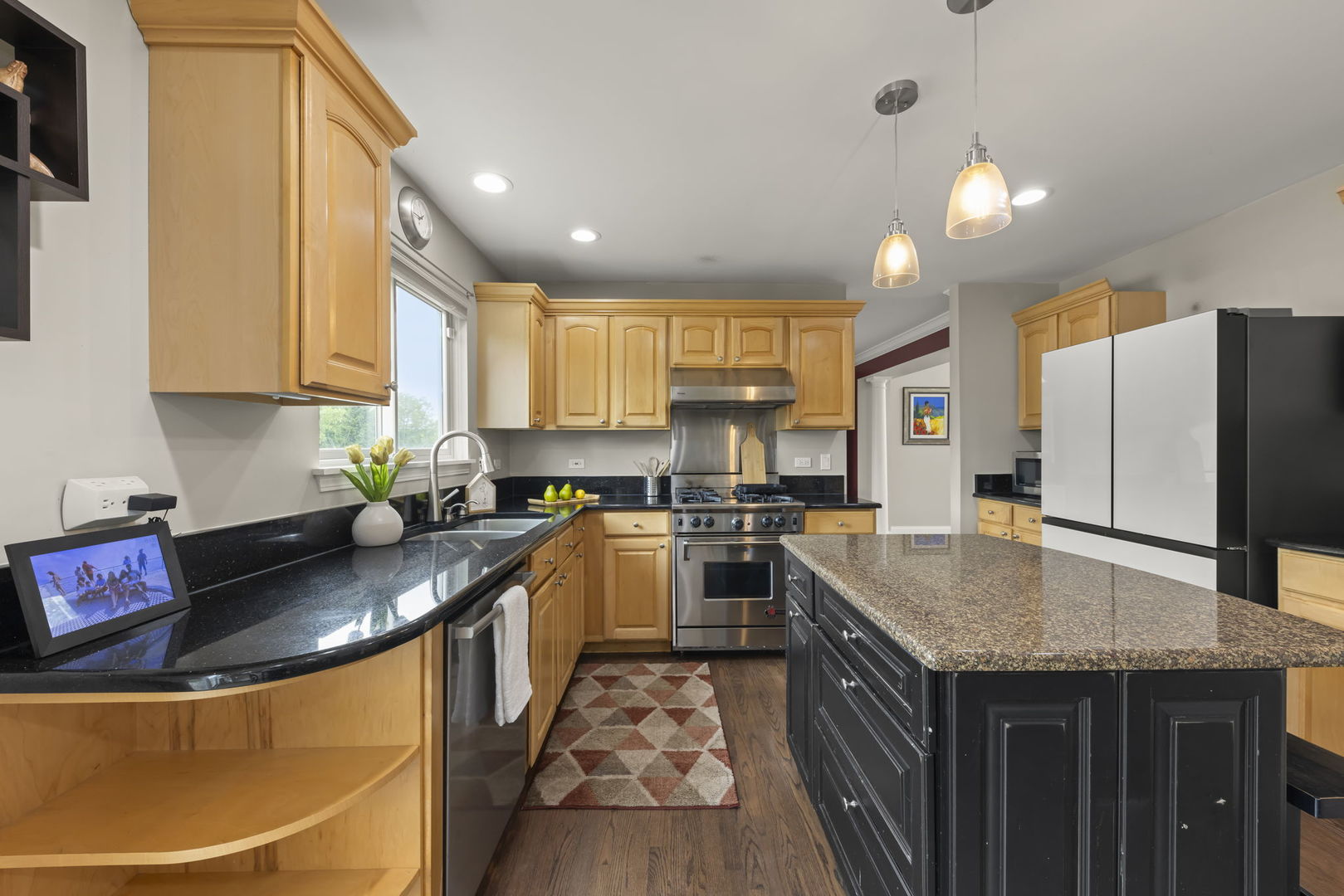 1462 Haversham Drive Aurora, IL 60502 - Photo 8 of 44 a kitchen with granite countertop a sink a counter top space stainless steel appliances and cabinets