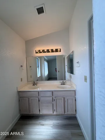 a room with a sink and cabinets