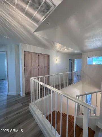 a view of entryway with wooden floor