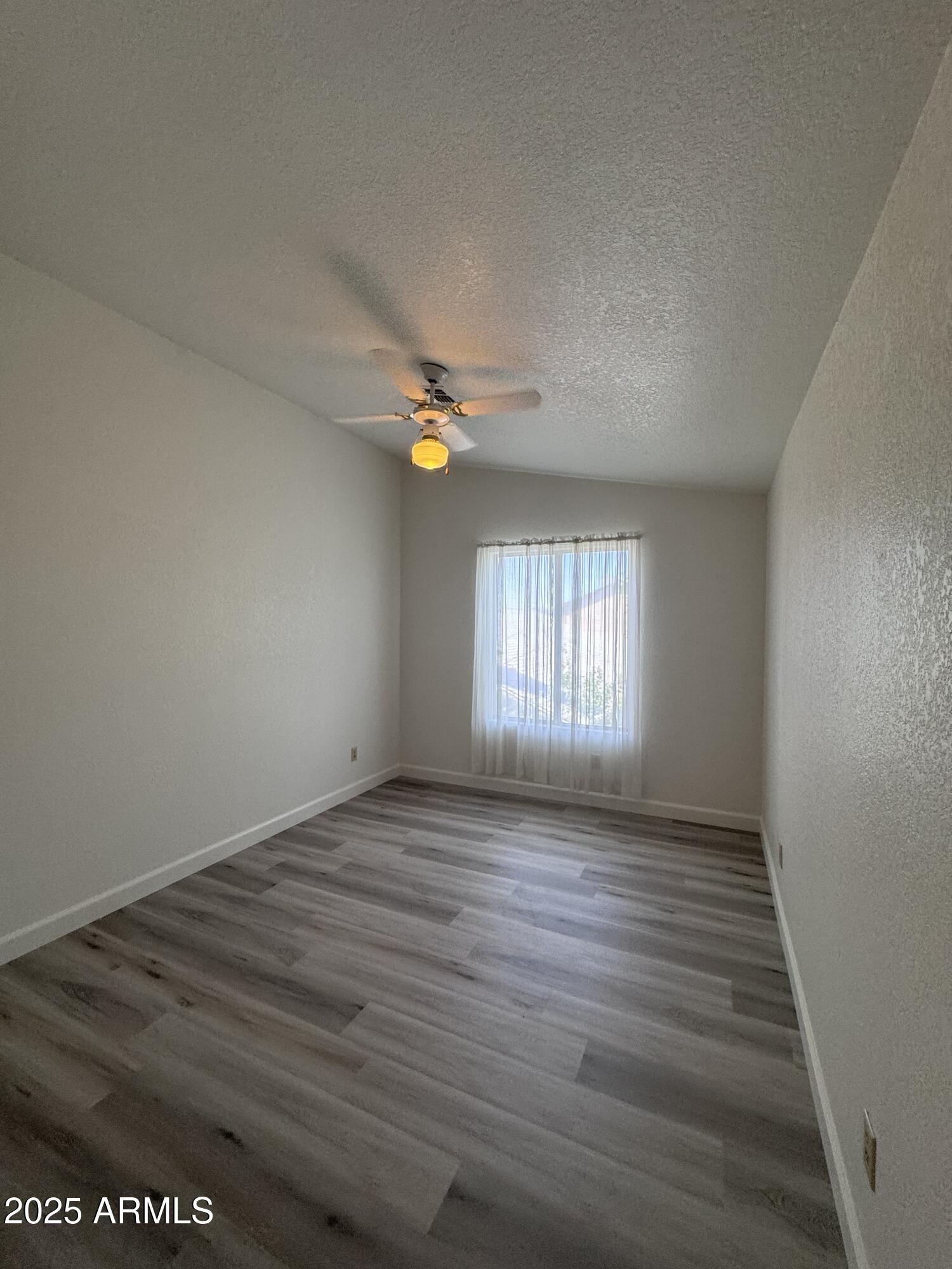 8631 West Monte Vista Road Phoenix, AZ 85037 - Photo 23 of 26 a view of an empty room and window