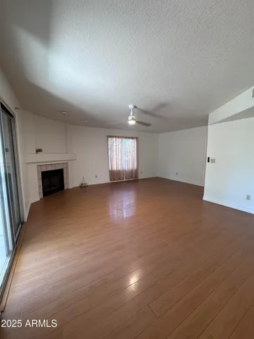 an empty room with a empty space and windows