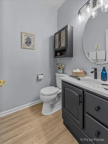 a kitchen with stainless steel appliances granite countertop a stove a sink dishwasher and a refrigerator with wooden cabinets