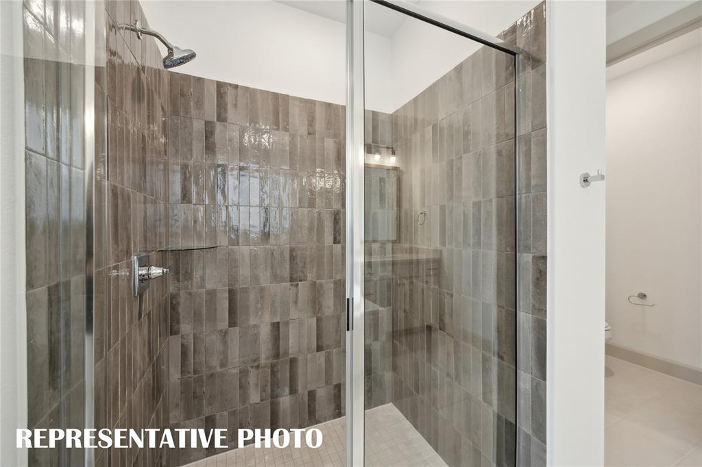 4170 Kestrel Street Prosper, TX 75078 - Photo 11 of 16 The oversized walk in shower in your new owner's bath is a dream come true. REPRESENTATIVE PHOTO