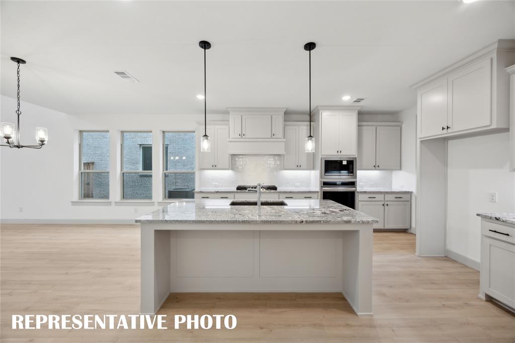 4170 Kestrel Street Prosper, TX 75078 - Photo 4 of 16 Offering outstanding storage and prep space, the chef inspired kitchen in our Orleans plan is a dream come true! REPRESENTATIVE PHOTO