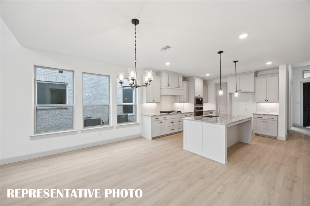 4170 Kestrel Street Prosper, TX 75078 - Photo 6 of 16 Whether it's lively dinner parties or cozy family meals, this wonderful dining room fits all occasions! REPRESENTATIVE PHOTO