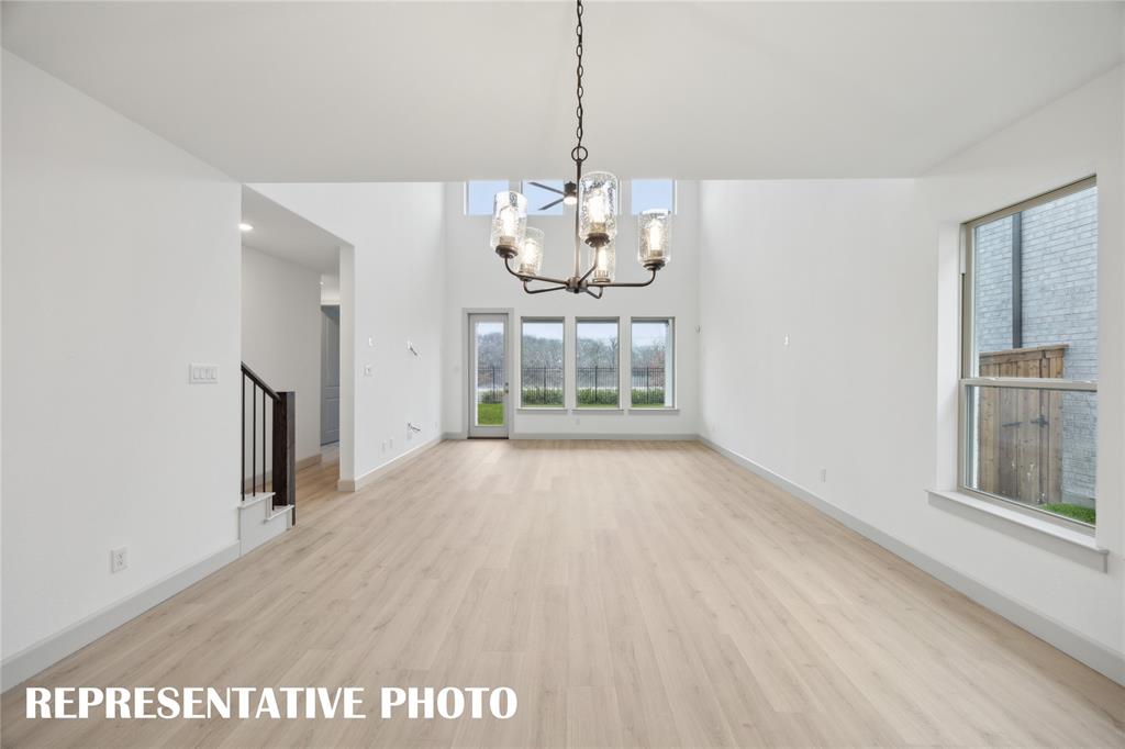 4170 Kestrel Street Prosper, TX 75078 - Photo 7 of 16 You'll enjoy a family room spacious enough to host the entire family in our Orleans plan! REPRESENTATIVE PHOTO