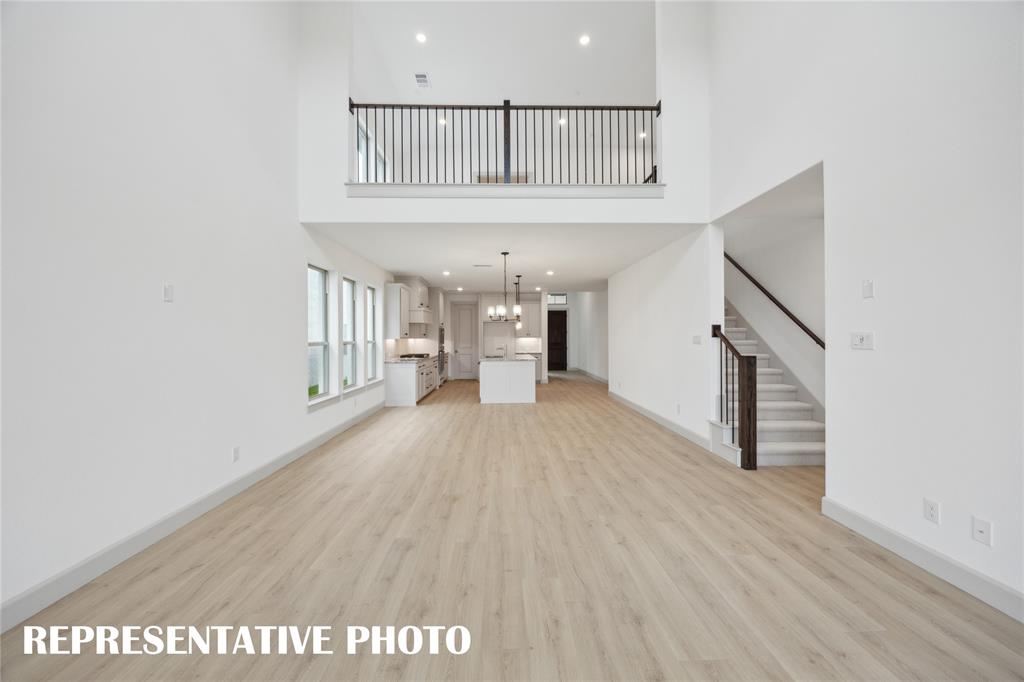 4170 Kestrel Street Prosper, TX 75078 - Photo 8 of 16 With the game room open to the family room, our Orleans plan offers a multi-level entertainment zone. REPRESENTATIVE PHOTO