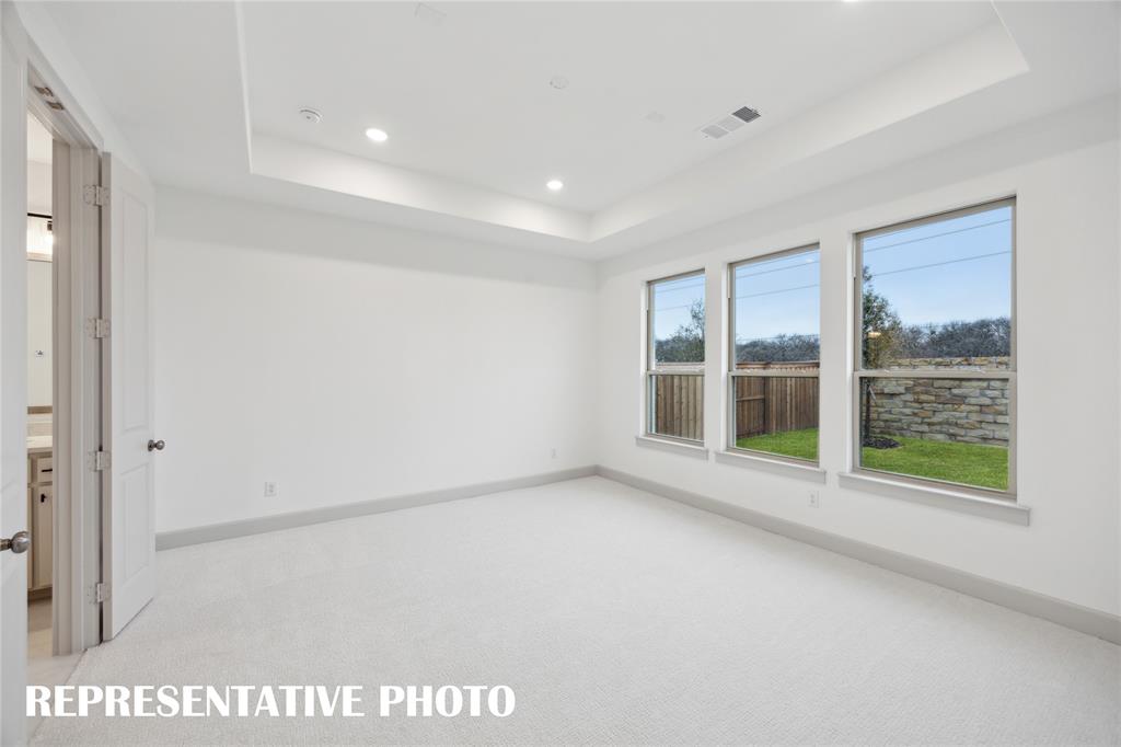 4170 Kestrel Street Prosper, TX 75078 - Photo 9 of 16 Located at the rear of the home for additional privacy, this owner's suite is the perfect space for rest and relaxation. REPRESENTATIVE PHOTO