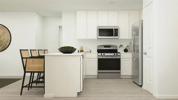 a kitchen with a stove and a refrigerator