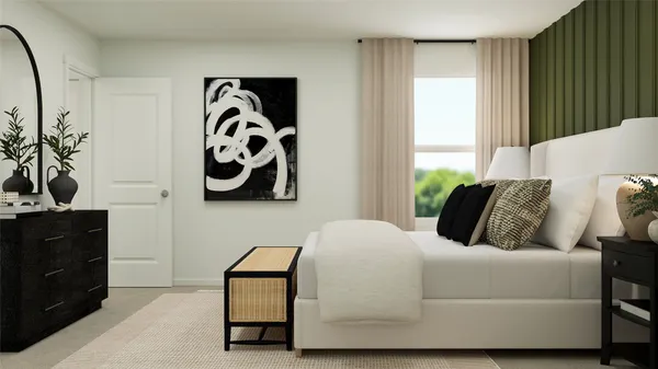 a bedroom with a bed and painting on the wall