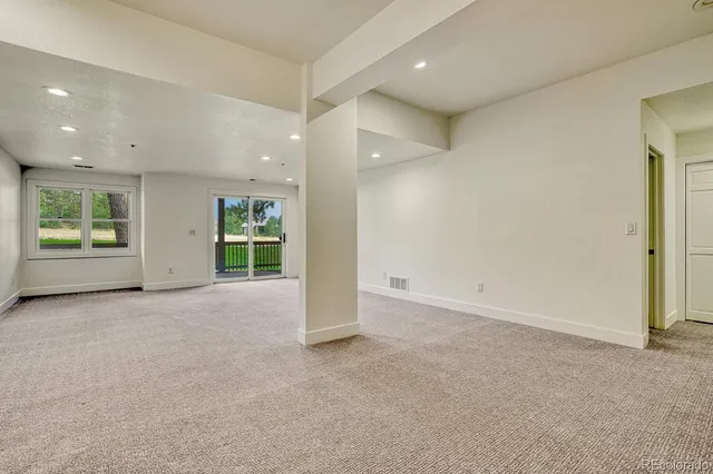 an empty room with windows