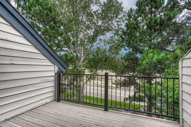 a view of a balcony with wooden floor