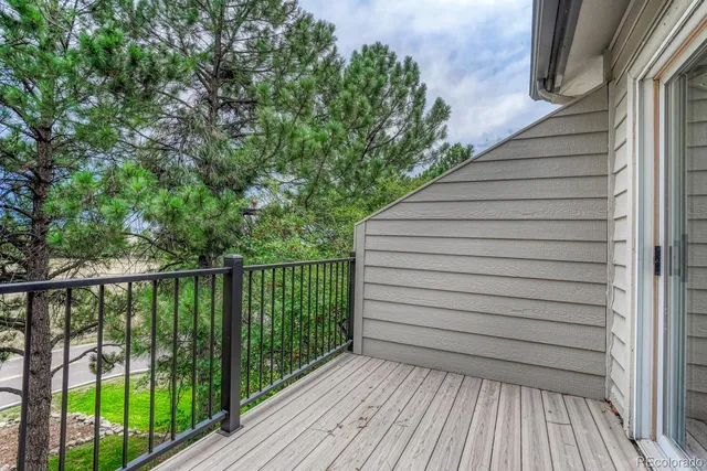 a view of a balcony with wooden floor