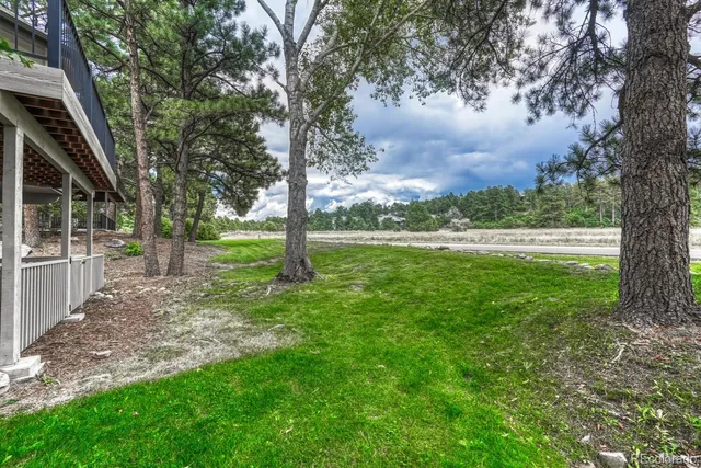 a view of outdoor space with deck and green space