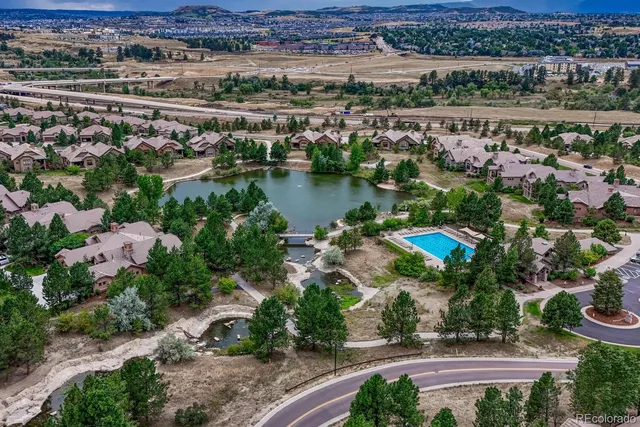 an aerial view of a city with lake view