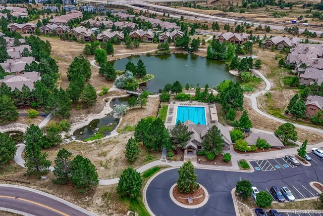 an aerial view of residential house with outdoor space and lake view