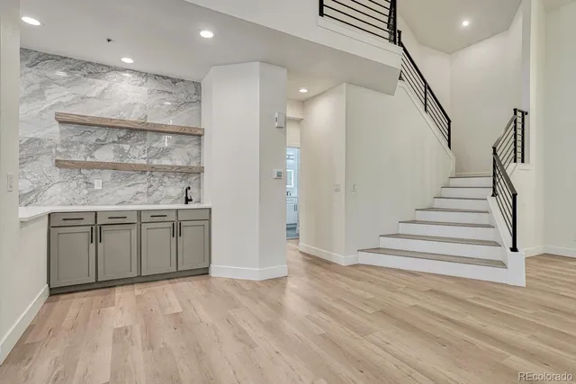 a view of a kitchen with a sink and cabinets