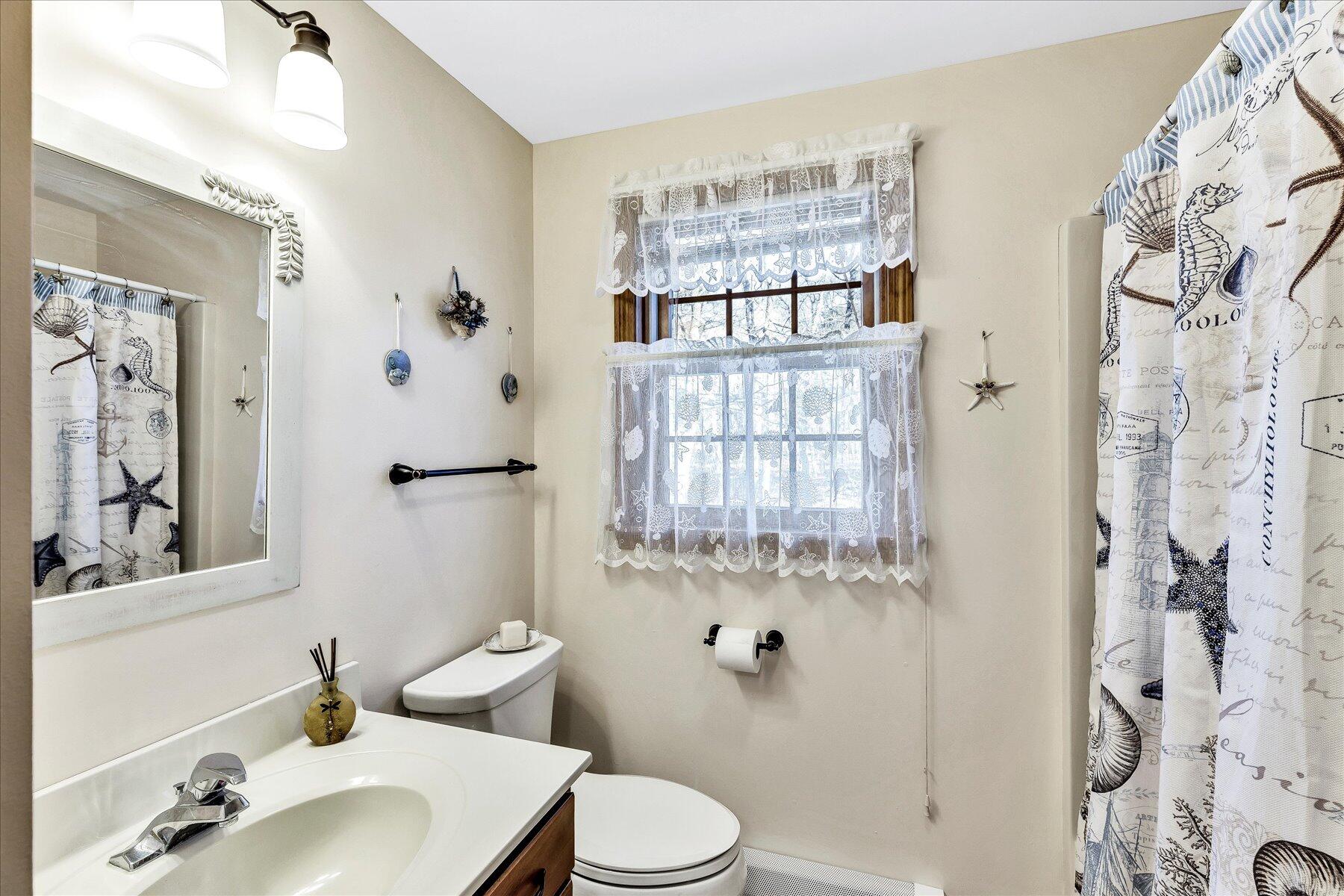 14 Fallon Road Eastham, MA 02642 - Photo 16 of 27 a bathroom with a sink toilet and shower