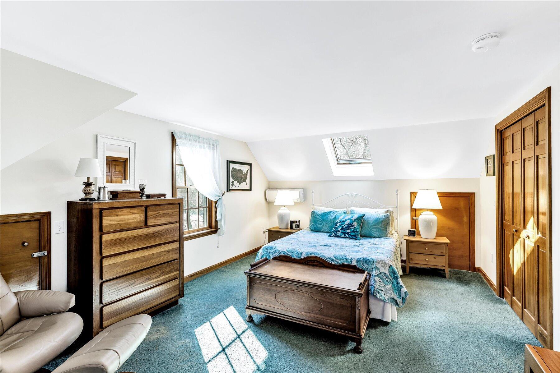 14 Fallon Road Eastham, MA 02642 - Photo 20 of 27 a bedroom with a bed and wooden floor