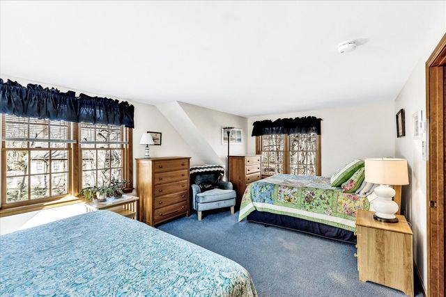 a bedroom with furniture and window