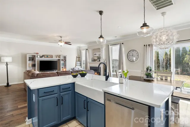 a kitchen with a sink stove and refrigerator