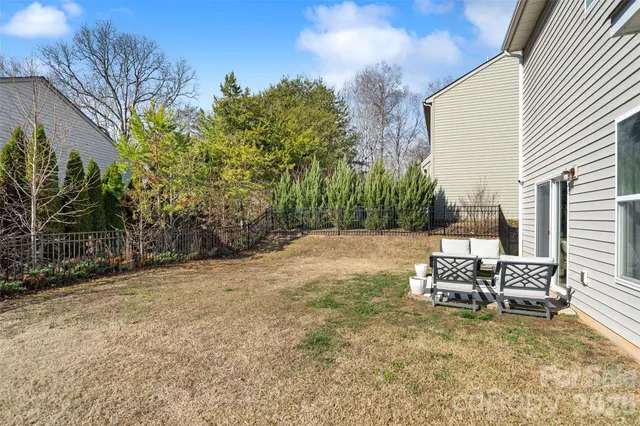 a street sign on a sidewalk next to a road