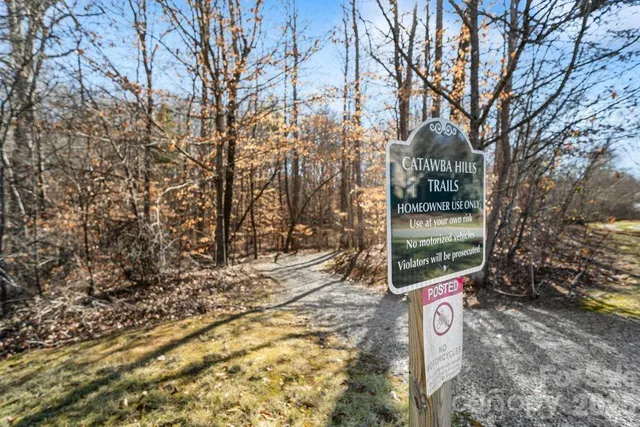 an aerial view of a house with a yard swimming pool and outdoor seating