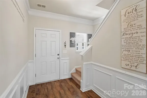a view of a living room kitchen with furniture and a ceiling fan