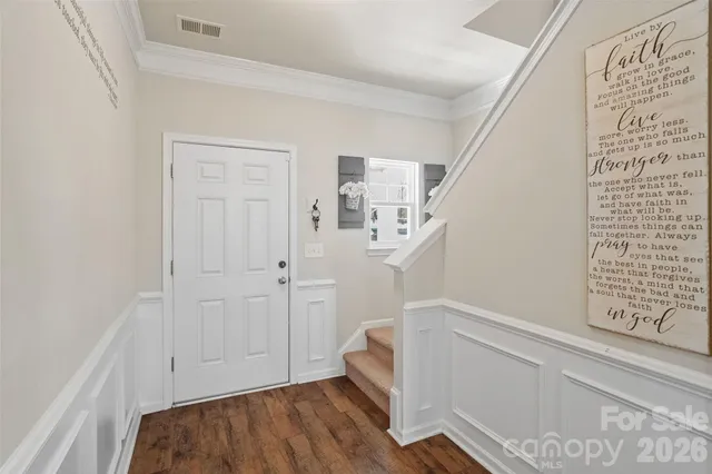 a view of a living room kitchen with furniture and a ceiling fan
