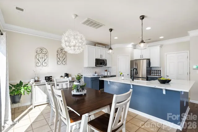 a view of kitchen with breakfast area