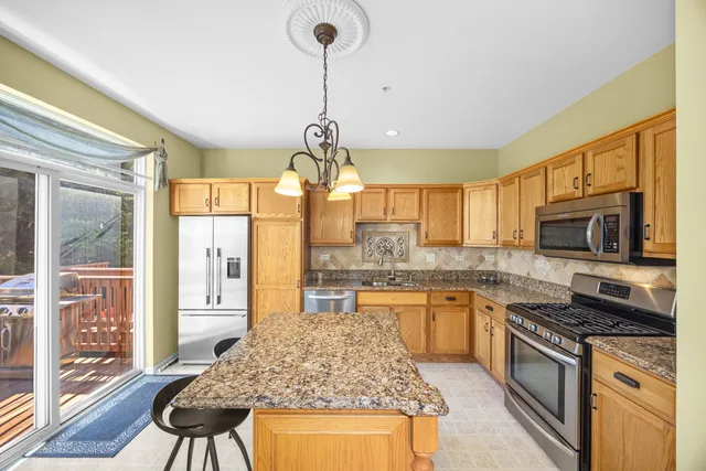 a kitchen with a stove a sink and a refrigerator