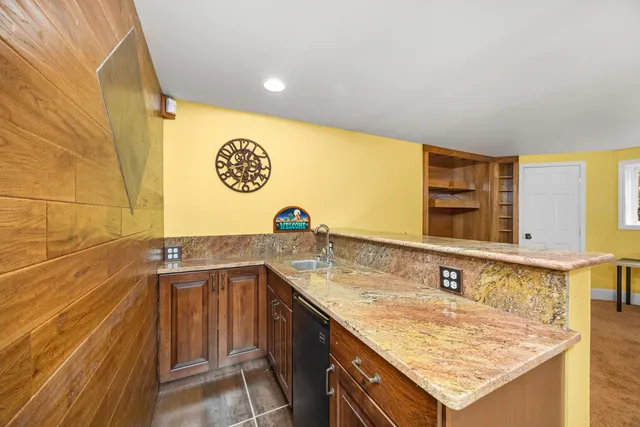 a bathroom with a shower and a sink