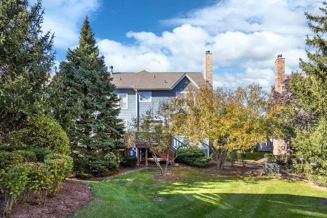 a view of a garden with a house