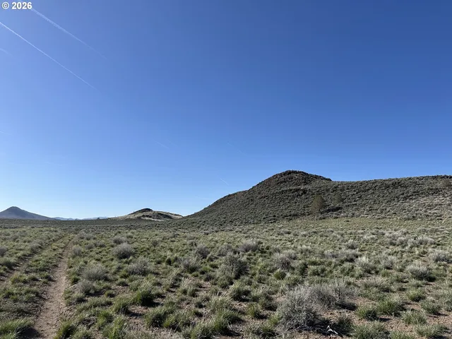 a view of mountains and valleys