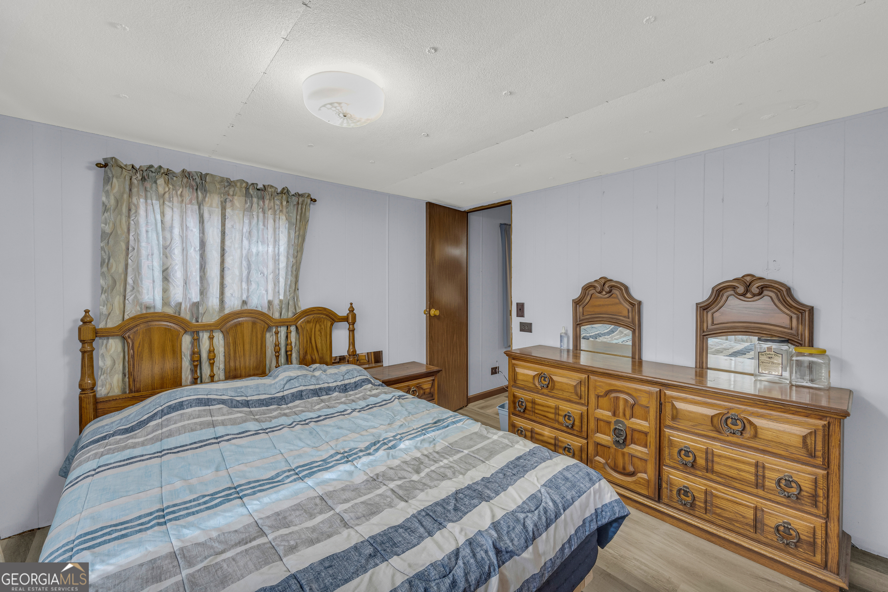 39 Valley View Drive Lavonia, GA 30553 - Photo 9 of 33 a bedroom with a bed and dresser