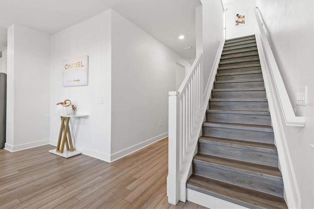 16235 Pine Mist Drive Bradenton, FL 34211 - Photo 18 of 100 a view of entryway and hall with wooden floor