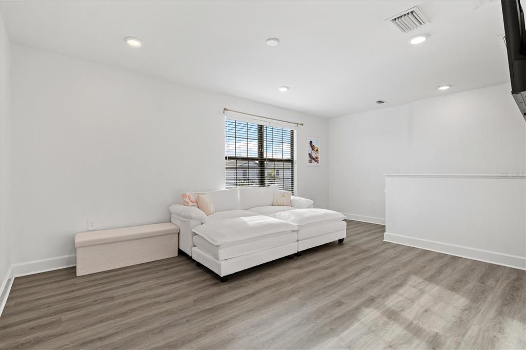 16235 Pine Mist Drive Bradenton, FL 34211 - Photo 21 of 100 a spacious bedroom with a bed and a large window