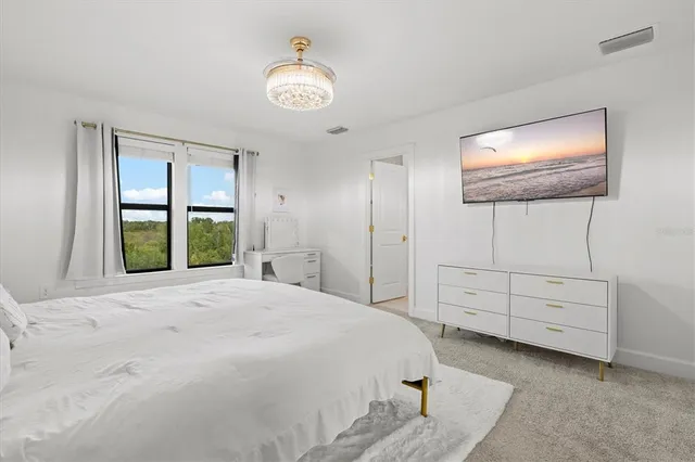 a outdoor space with the couches and dining table with garden view