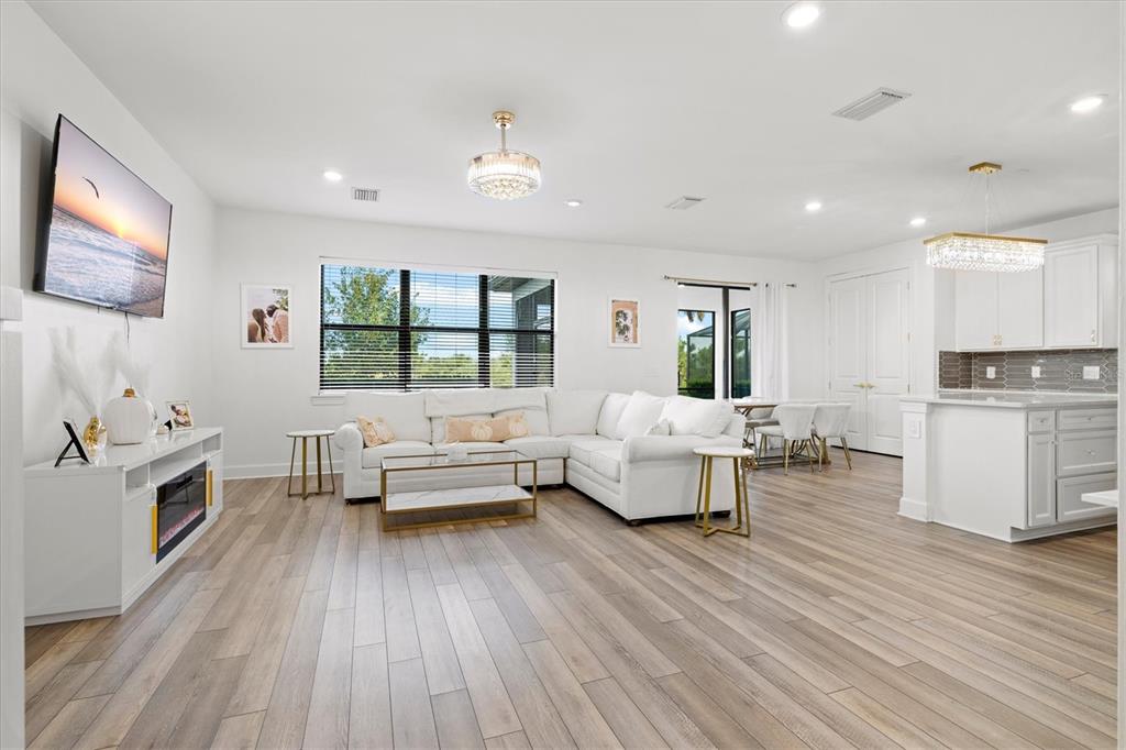 16235 Pine Mist Drive Bradenton, FL 34211 - Photo 3 of 100 a living room with furniture and a large window