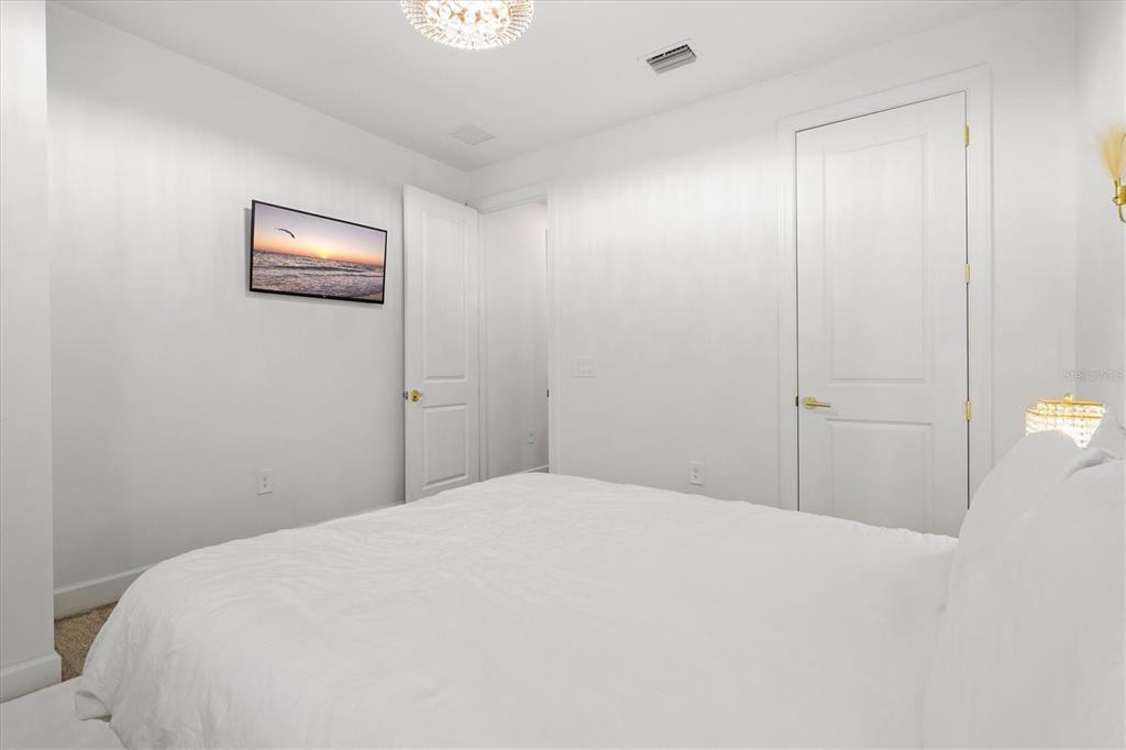 16235 Pine Mist Drive Bradenton, FL 34211 - Photo 35 of 100 a bedroom with a bed and a table