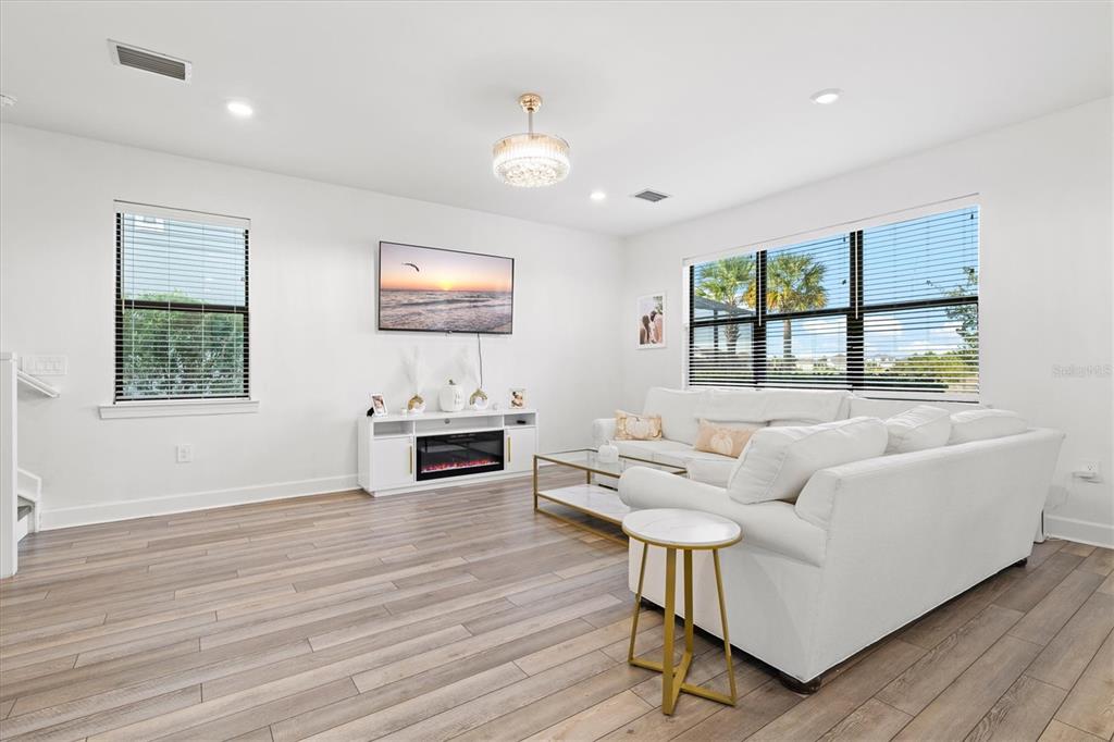 16235 Pine Mist Drive Bradenton, FL 34211 - Photo 4 of 100 a living room with furniture and a flat screen tv