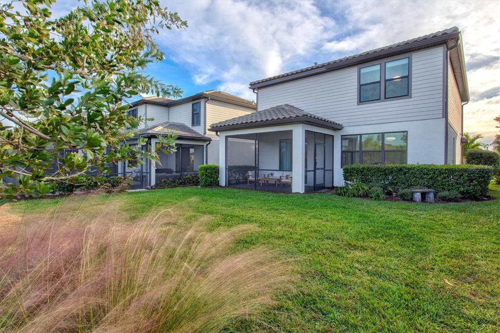 16235 Pine Mist Drive Bradenton, FL 34211 - Photo 41 of 100 a view of a house with big yard plants and large trees