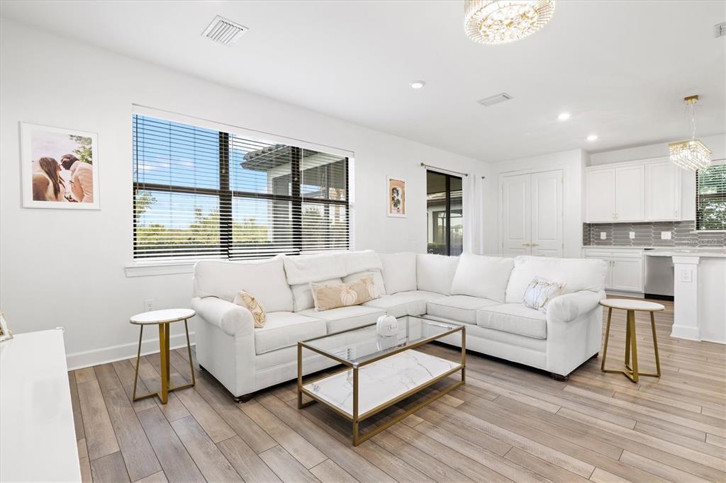 16235 Pine Mist Drive Bradenton, FL 34211 - Photo 7 of 100 a living room with furniture and a large window