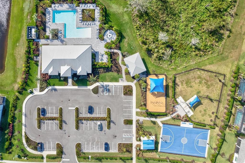 16235 Pine Mist Drive Bradenton, FL 34211 - Photo 77 of 100 an aerial view of residential houses with outdoor space and parking