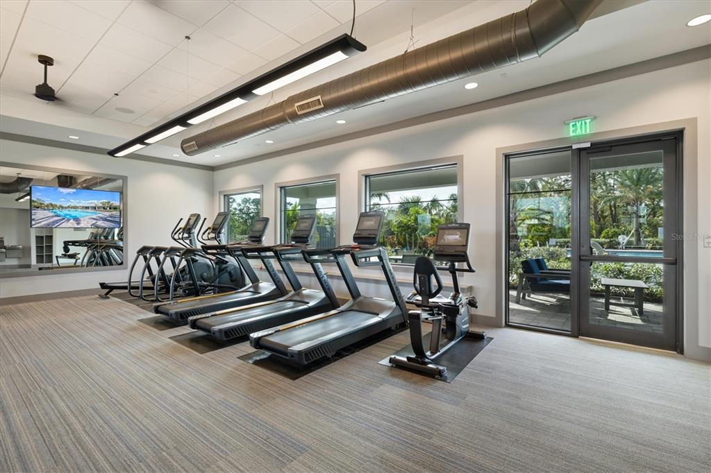 16235 Pine Mist Drive Bradenton, FL 34211 - Photo 78 of 100 a view of a room with gym equipment