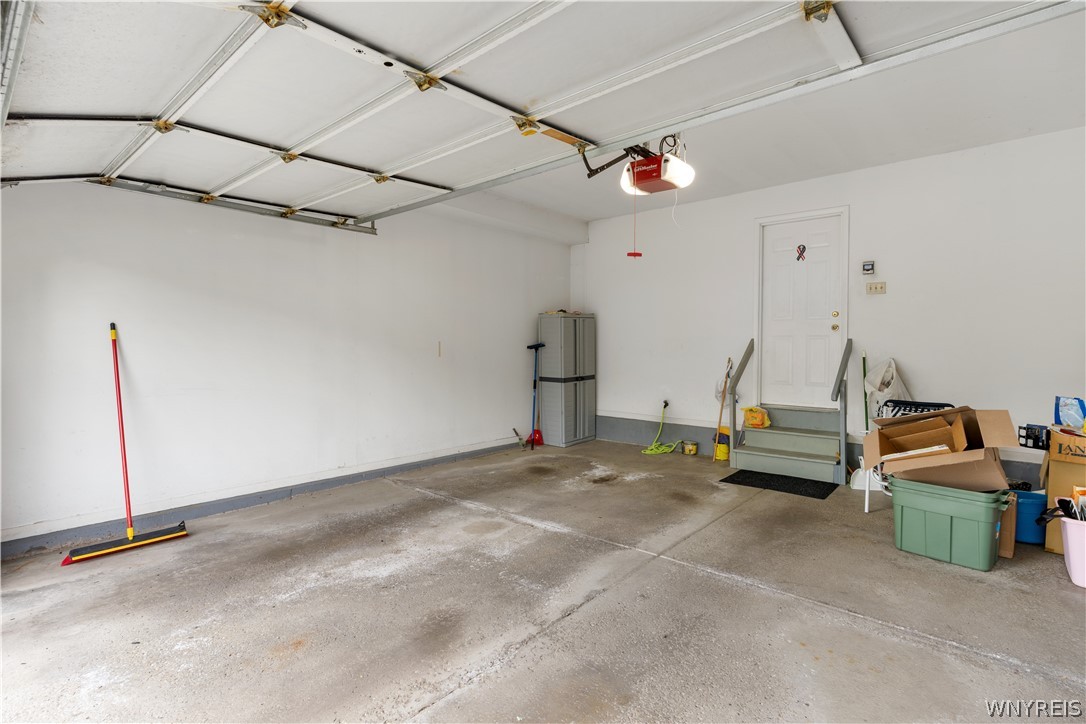 2850 Amsdell Road, Unit 34 Hamburg, NY 14075 - Photo 27 of 33 An attached garage provides direct home access through a short set of stairs.
