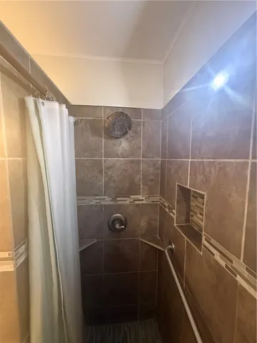 a white toilet sitting next to a bathroom sink