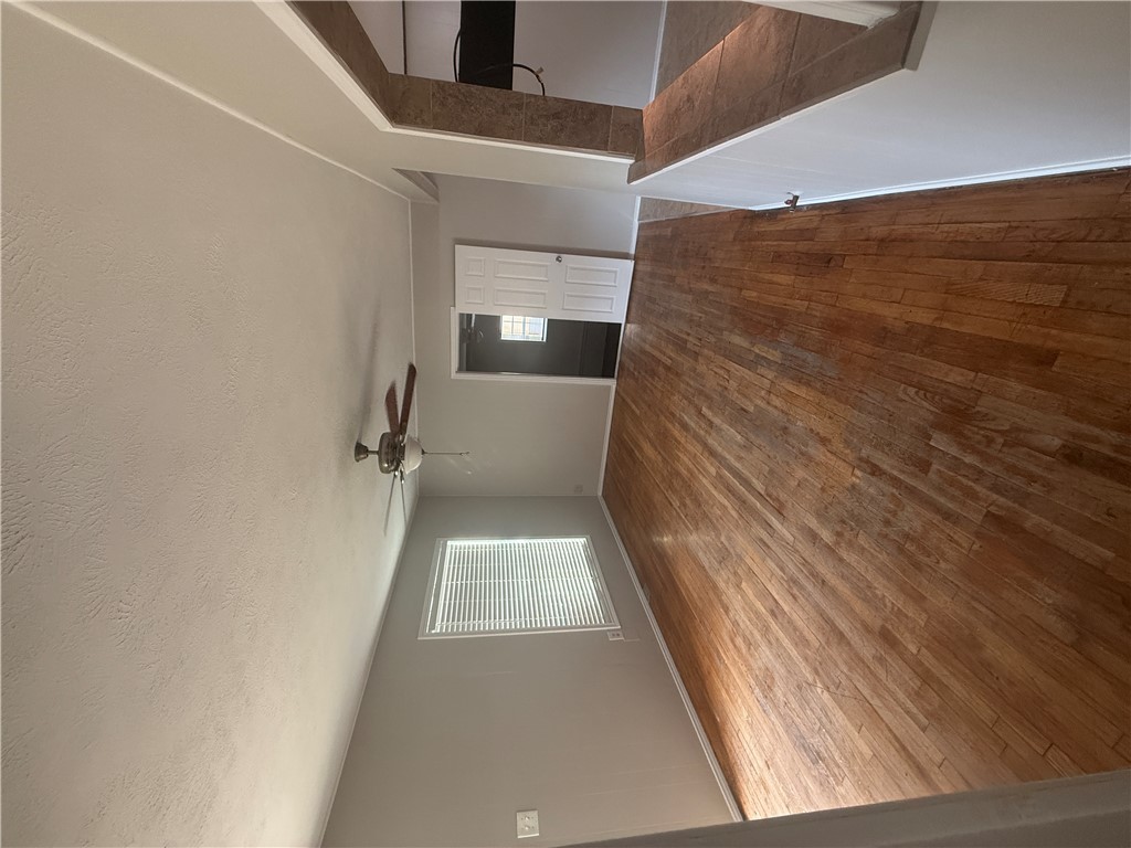 709 Churchill Drive Bryan, TX 77801 - Photo 13 of 31 a view of empty room with wooden floor