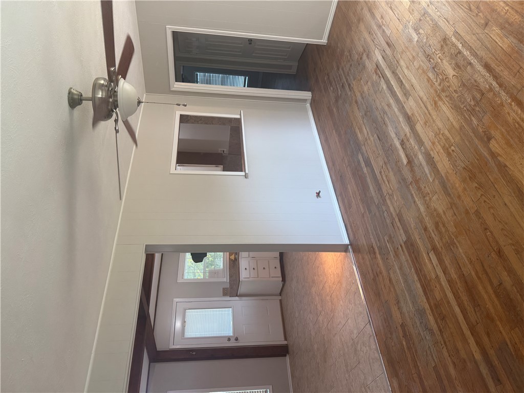 709 Churchill Drive Bryan, TX 77801 - Photo 18 of 31 a view of livingroom with hardwood floor and ceiling fan